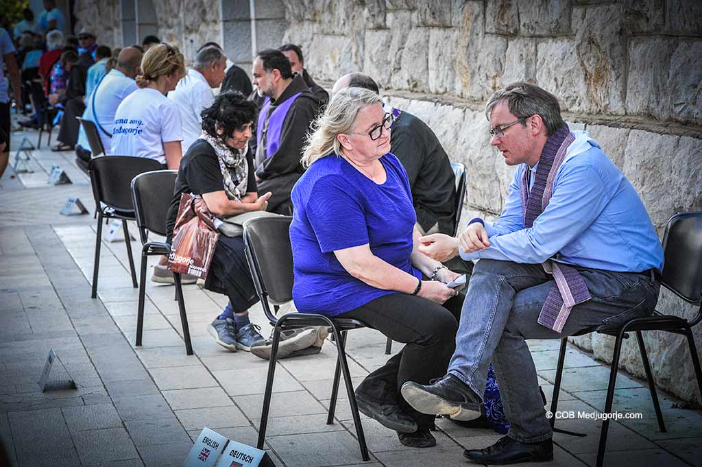 Pilgrims go to confession in Medjugorje
